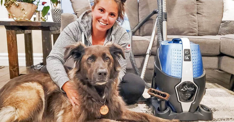 Sirena water vacuum beside a pet dog at home