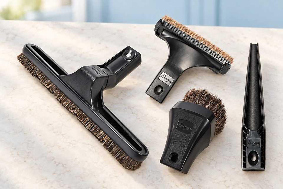 Genuine Sirena floor, upholstery, dusting and crevice tools laid out for selection.